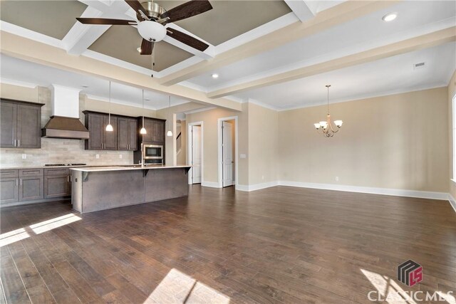 1380 Melody Bnd Unit 45, Watkinsville, GA 30677 - kitchen with stainless steel microwave, custom exhaust hood, cooktop, a kitchen bar, and beamed ceiling