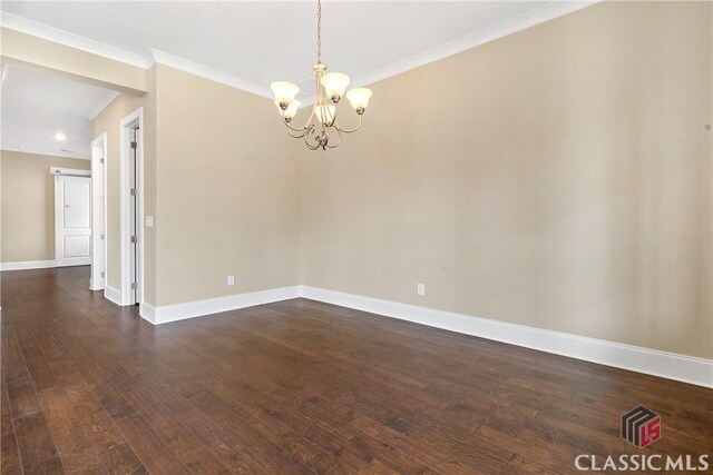 1380 Melody Bnd Unit 45, Watkinsville, GA 30677 - unfurnished room with crown molding, an inviting chandelier, baseboards, and dark wood finished floors