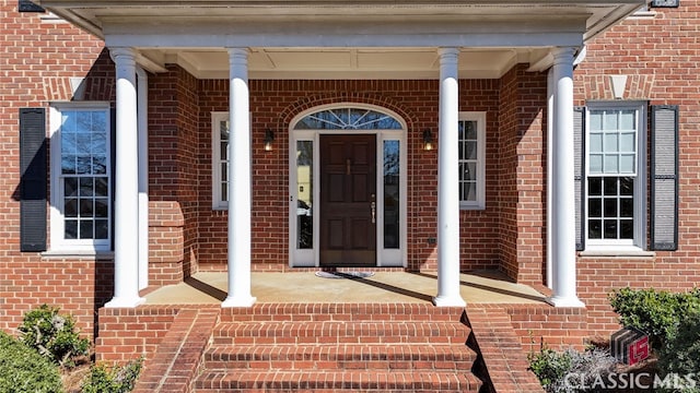 entrance to property with a porch