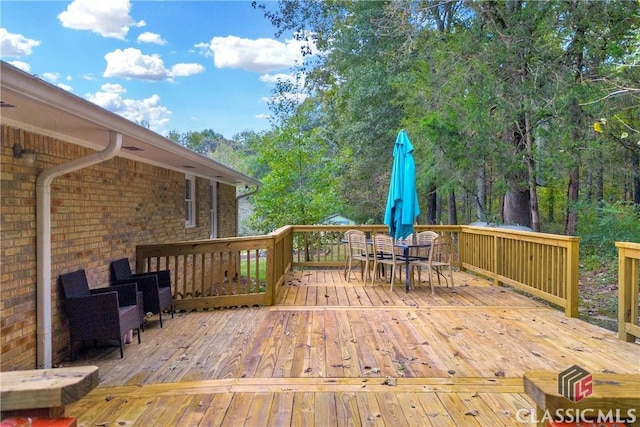 wooden deck with outdoor dining space