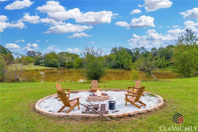 view of yard with a fire pit and a patio area