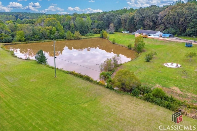 aerial view featuring a water view and a wooded view