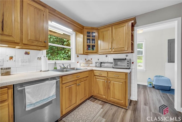 kitchen with a sink, a wealth of natural light, a toaster, and dishwasher