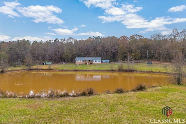 property view of water with a wooded view