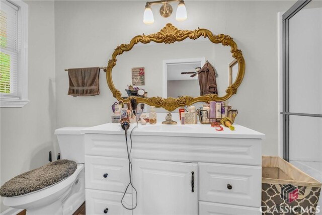 bathroom featuring toilet and vanity