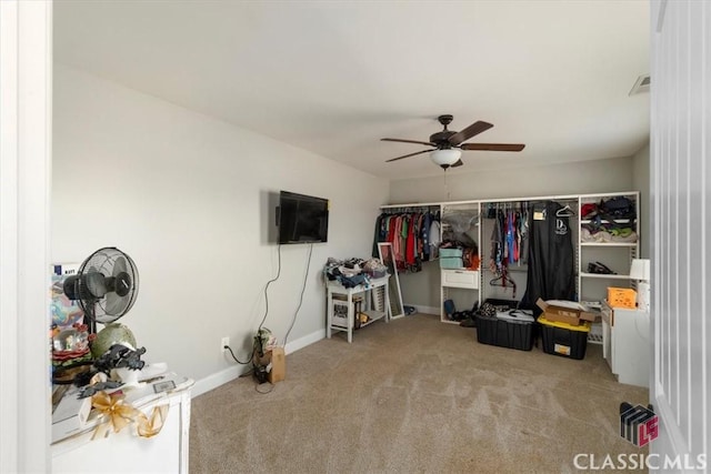 carpeted bedroom featuring visible vents, ceiling fan, and baseboards