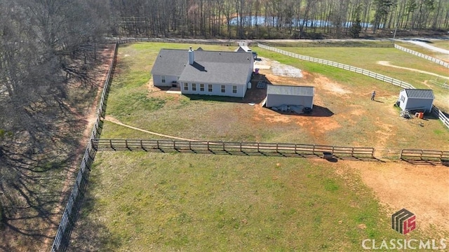 birds eye view of property with a rural view