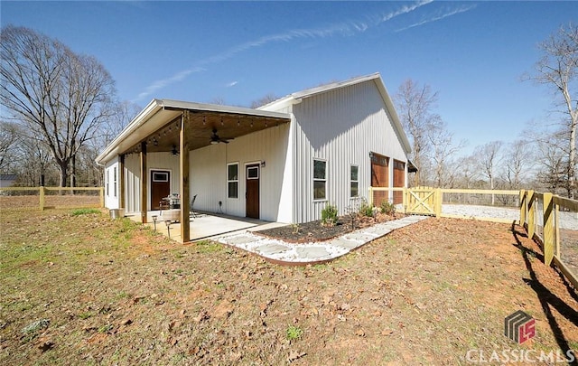 exterior space with ceiling fan, a patio, and fence