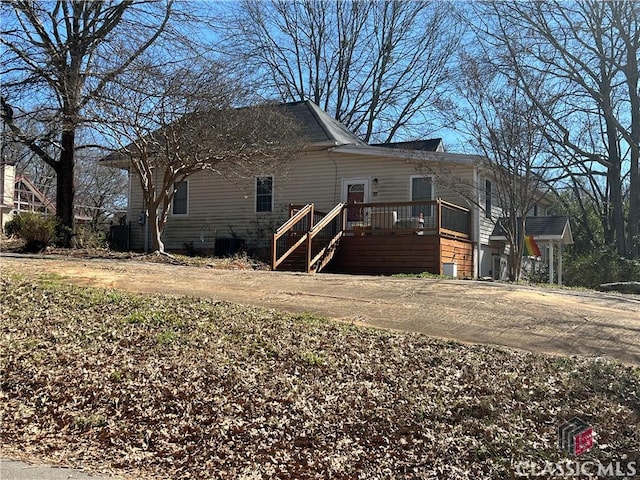 view of home's exterior with driveway