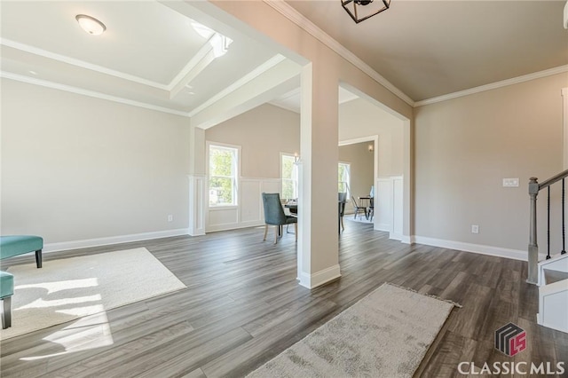 interior space with crown molding, baseboards, dark wood-style floors, and stairs