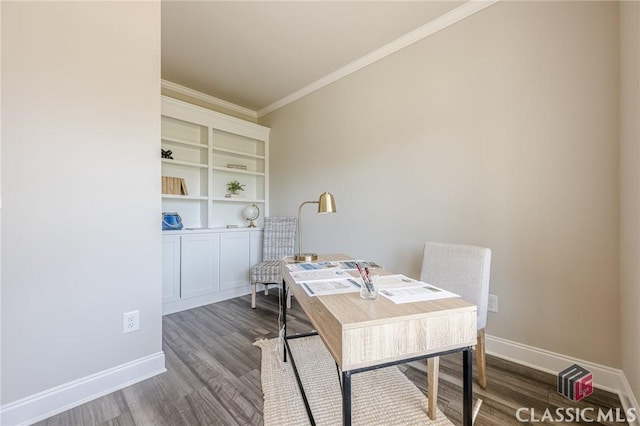 office space featuring baseboards, ornamental molding, and wood finished floors