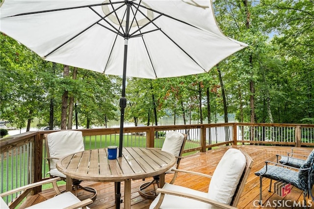 wooden terrace featuring outdoor dining space