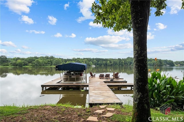 dock area with a water view and boat lift