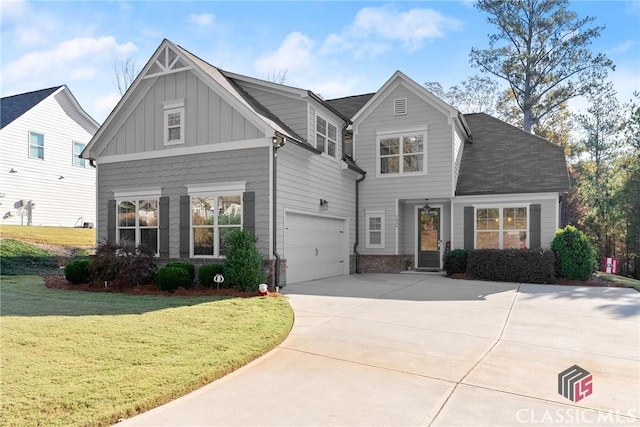 view of front of home with a garage, concrete driveway, board and batten siding, and a front yard