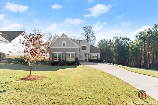 view of front of property featuring board and batten siding and a front yard