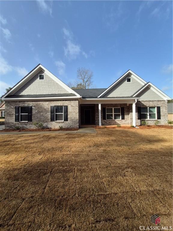 view of front of home with a front lawn