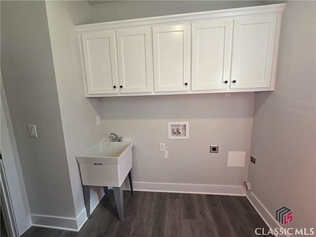 laundry room with dark wood-style floors, hookup for a washing machine, cabinet space, hookup for an electric dryer, and baseboards