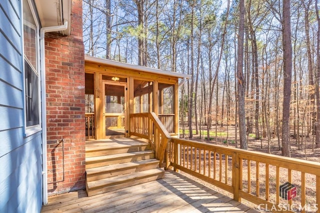 deck with a sunroom