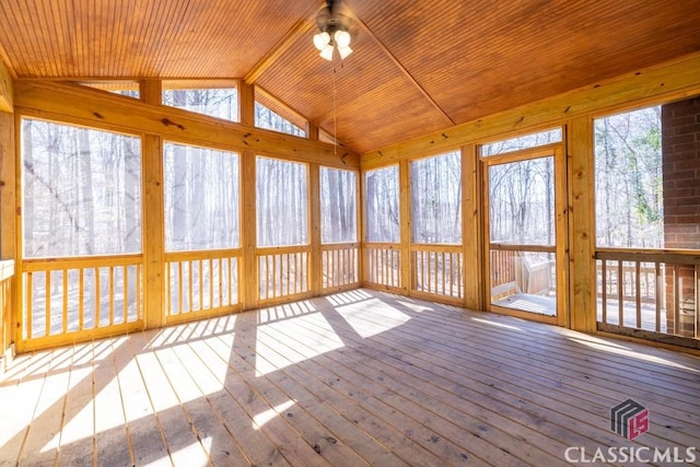 unfurnished sunroom with lofted ceiling, ceiling fan, and wood ceiling