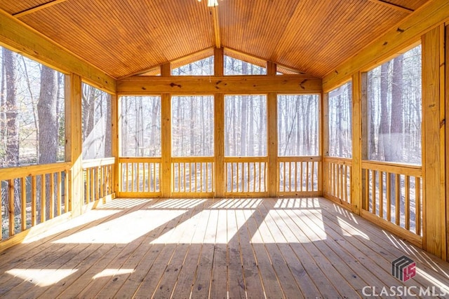 unfurnished sunroom featuring lofted ceiling and wood ceiling