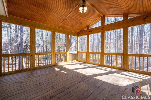 unfurnished sunroom with lofted ceiling and wood ceiling