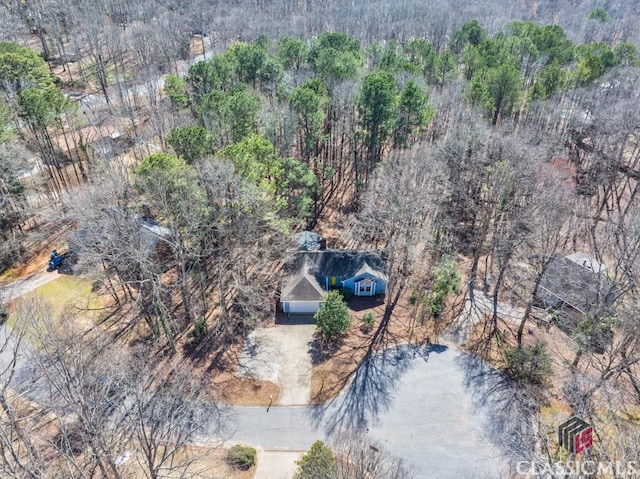 bird's eye view featuring a view of trees