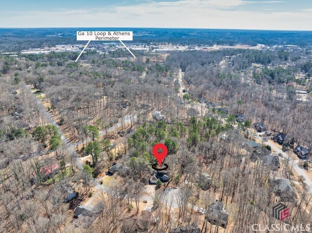 drone / aerial view featuring a view of trees