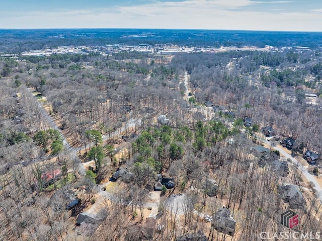 drone / aerial view with a view of trees