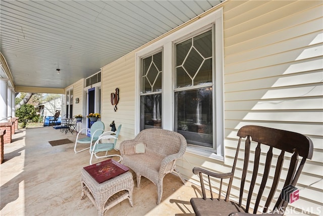 view of patio featuring a porch