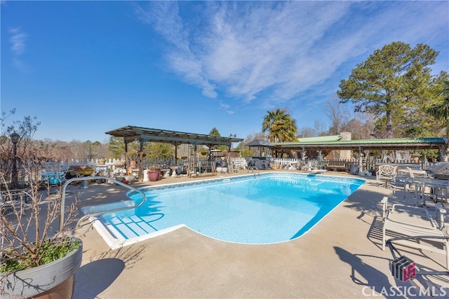 view of pool with a patio, a fenced in pool, and a pergola