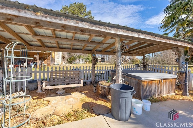 view of patio / terrace with a hot tub