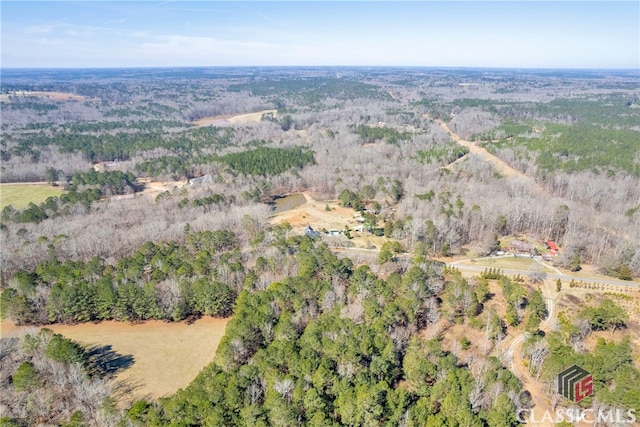 bird's eye view featuring a forest view