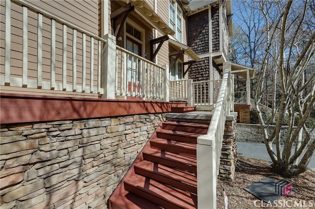 view of property exterior featuring stairs