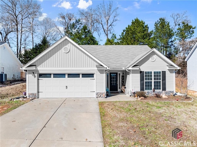 ranch-style home featuring board and batten siding, driveway, and an attached garage