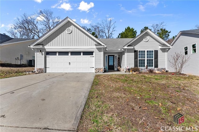 ranch-style home featuring board and batten siding, concrete driveway, and a garage