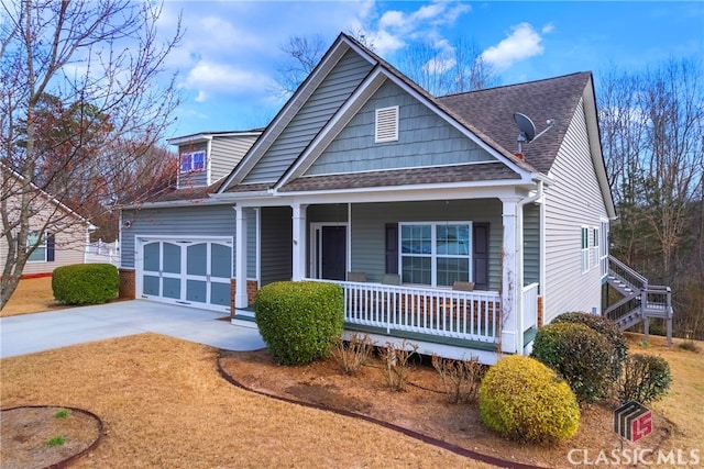 view of front of property with covered porch, roof with shingles, and driveway