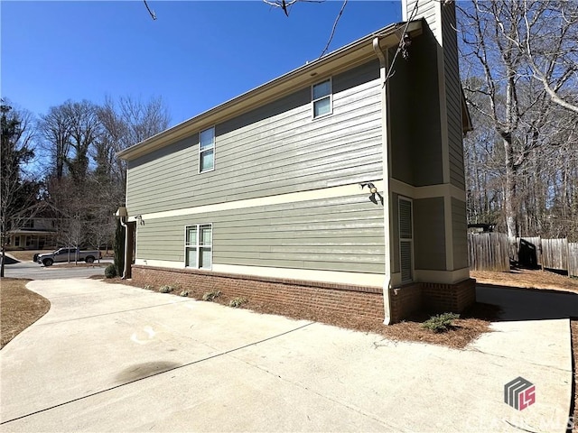 view of property exterior featuring fence