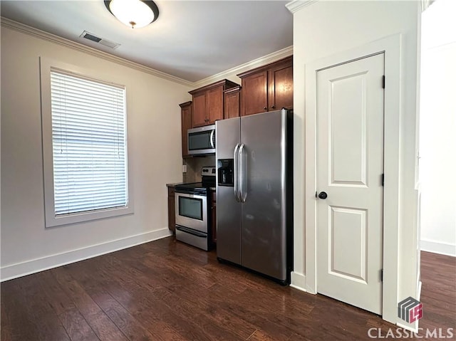 kitchen featuring baseboards, visible vents, appliances with stainless steel finishes, ornamental molding, and dark wood-style flooring