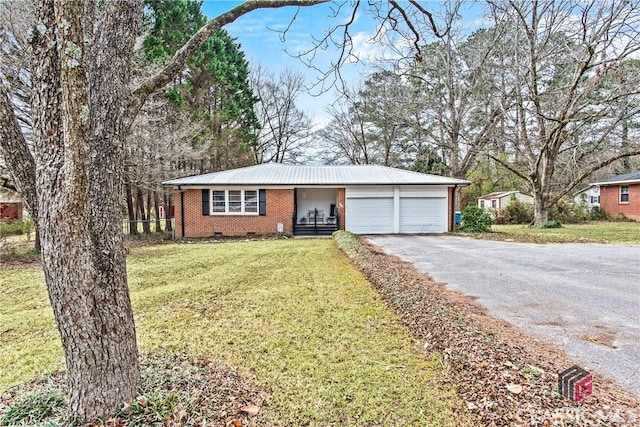 ranch-style house featuring brick siding, a front yard, crawl space, a garage, and driveway