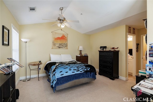 bedroom featuring lofted ceiling, baseboards, visible vents, and light colored carpet