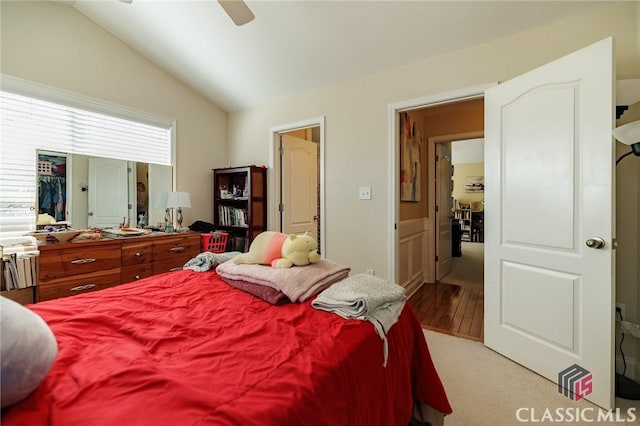 bedroom with vaulted ceiling and a ceiling fan