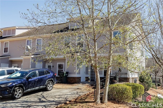 townhome / multi-family property with brick siding