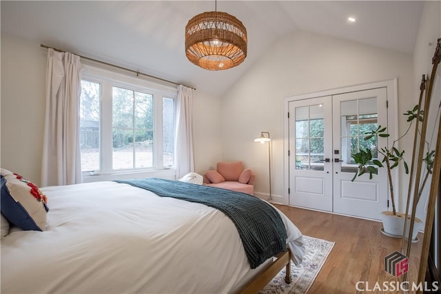 bedroom with vaulted ceiling, french doors, wood finished floors, and recessed lighting