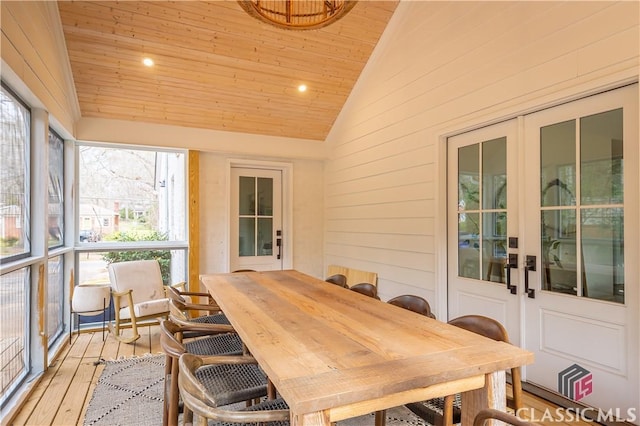 sunroom with lofted ceiling, wooden ceiling, and french doors