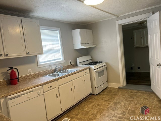 kitchen featuring white appliances, a sink, and white cabinets