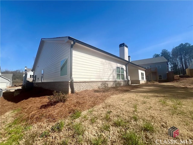 view of home's exterior featuring a chimney