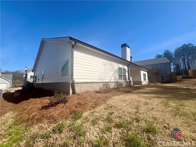 view of home's exterior with a chimney