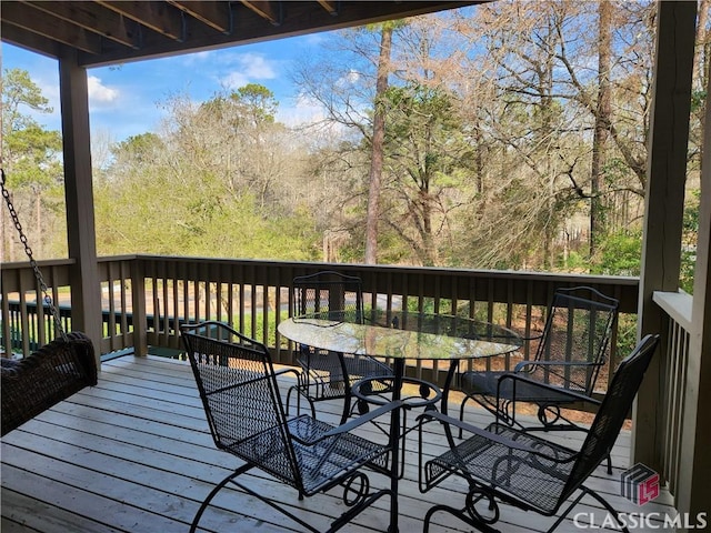 deck with outdoor dining space