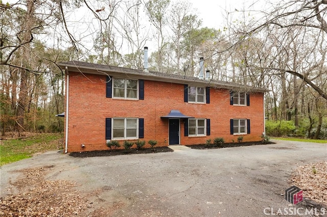 view of front of house featuring brick siding