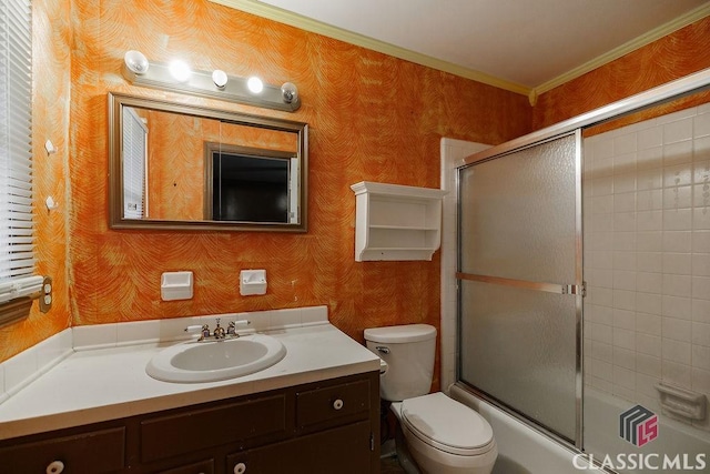 bathroom featuring toilet, wallpapered walls, and vanity